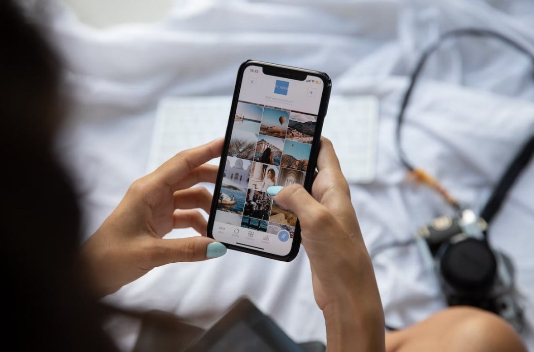 a female editing photos on iphone